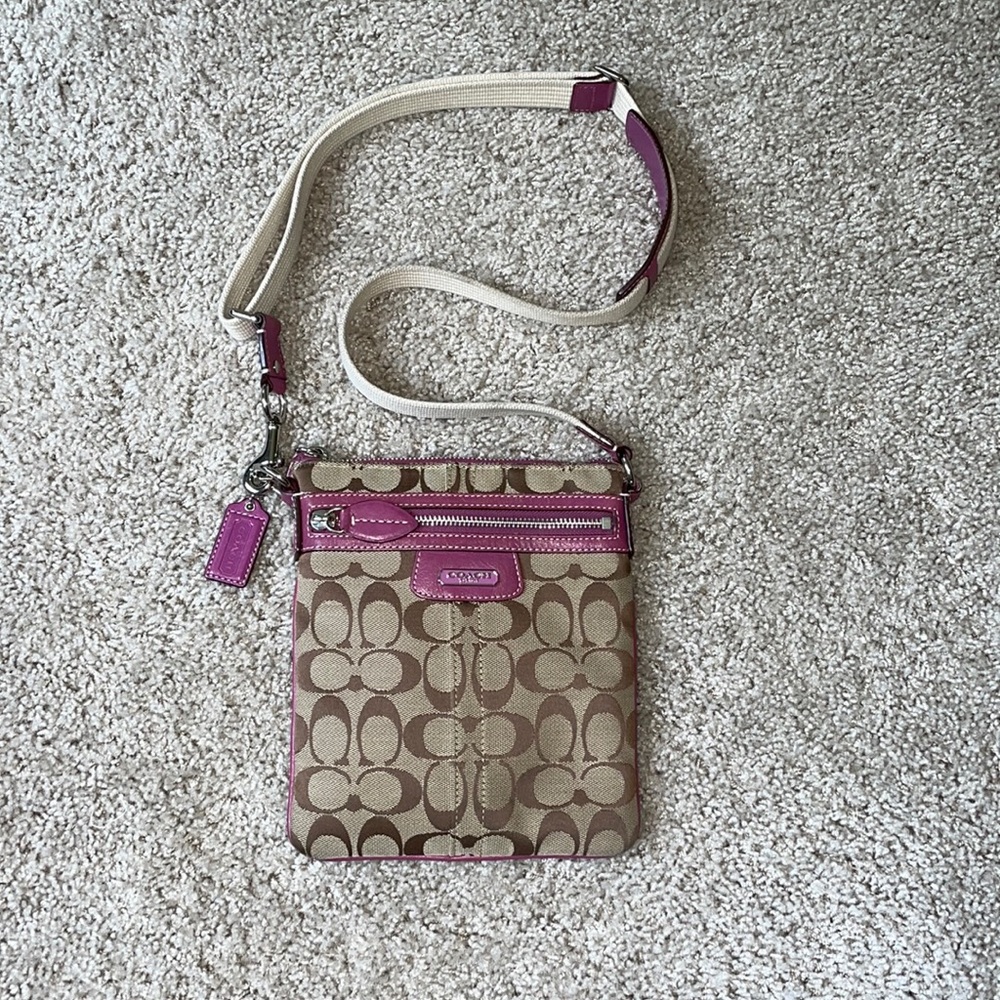 Coach Woman's Crossbody handbag with outer and inner pockets. 8” X 7”